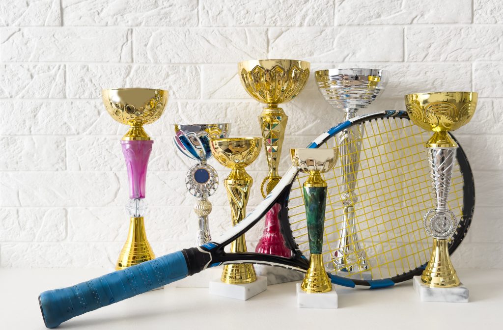 Celebrating Sports Achievements with Medals and Resin Trophies